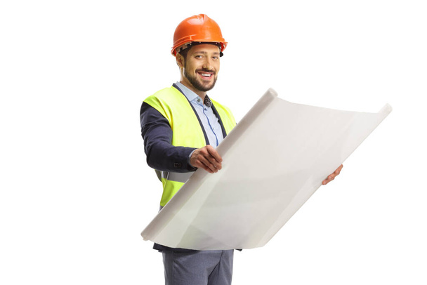 Engineer holding a blueprint and looking at camera isolated on white background - Foto, Bild
