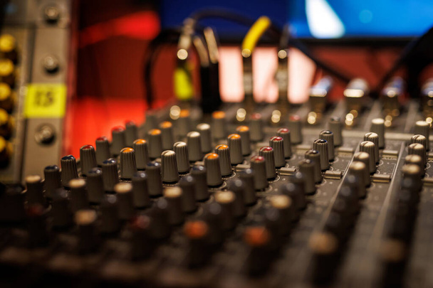 Sliders and knobs at an audio mixing console - Photo, Image