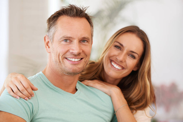 Portrait, hug and couple with relationship, romance and quality time with happiness, bonding and loving. Face, mature man and woman with a smile, cheerful and marriage with joy, happy and romantic. - Fotoğraf, Görsel