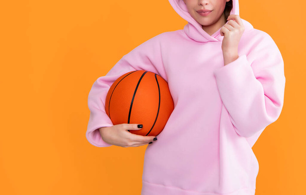 hipster girl student with basketball ball on yellow background. - Foto, Bild