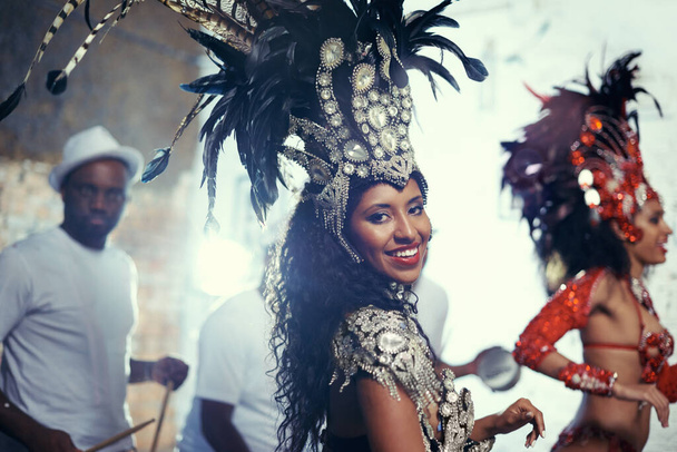 Festival portrait, carnival dancer and woman smile with music and party celebration in Brazil. Mardi gras, dancing and culture event costume with young female person with happiness from performance. - Foto, Bild
