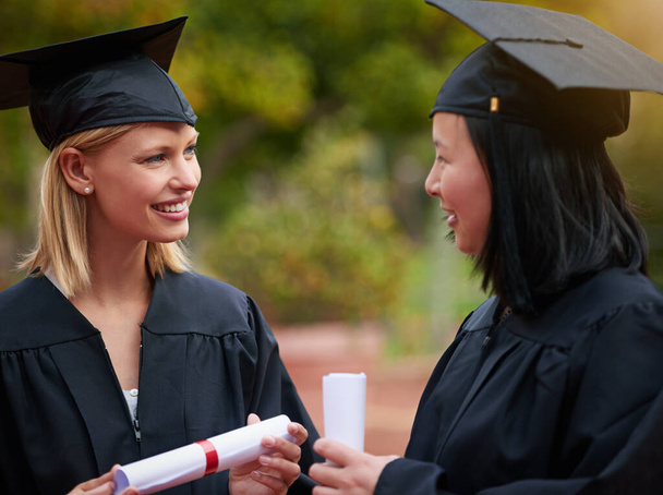 Graduation, girl friends and study diploma of students with happy communication outdoor. Mockup, female student and campus graduate with happiness and college achievement with diversity and toga. - Fotoğraf, Görsel