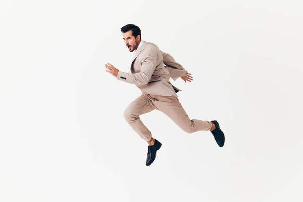 zakenman running jumping winnaar glimlach stijlvolle business geïsoleerde vliegende pak achtergrond arm baard mode gelukkig overwinning lachende beige sexy bril - Foto, afbeelding