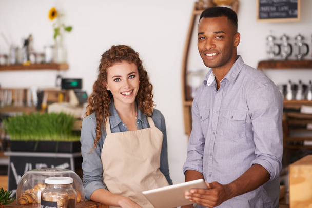 Cafe owners, tablet and portrait of people, training and coaching in store. Waiters, black man and happy woman in restaurant with technology for inventory, stock check and managing sales online - Photo, image