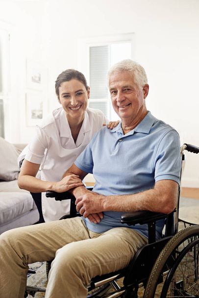 Portrait, nurse and man with disability in wheelchair for medical trust, wellness and support in nursing home. Happy caregiver helping senior patient with chronic health condition in rehabilitation. - 写真・画像