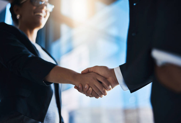 Ready to double up on their success. Closeup shot of two unrecognizable businesspeople shaking hands in an office - Photo, Image