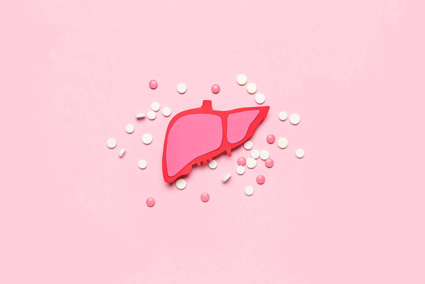 Paper liver with pills on pink background - Photo, Image