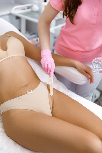 Bikini waxing,Intimate waxing, Hair removal, bikini area. laser epilation on bikini. Rejuvenation Treatments in Cosmetic Beauty Clinics, - Foto, Bild