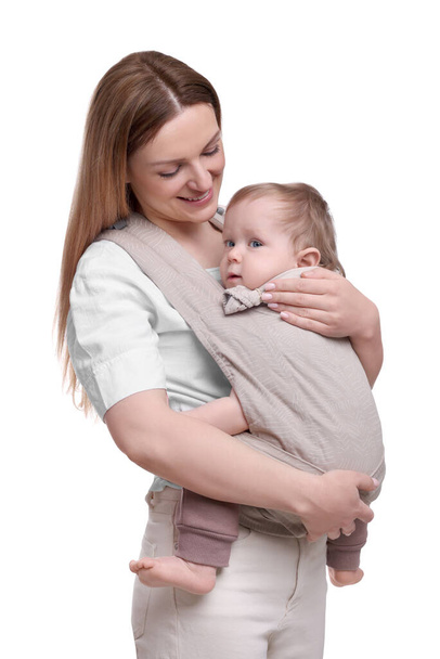 Mother holding her child in sling (baby carrier) on white background - Zdjęcie, obraz