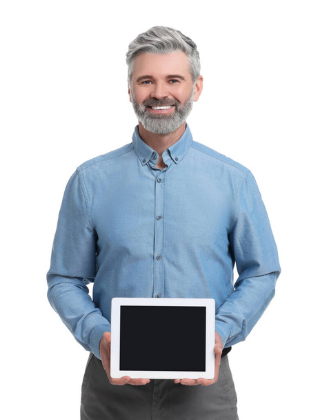 Mature businessman in stylish clothes with tablet on white background - Foto, imagen