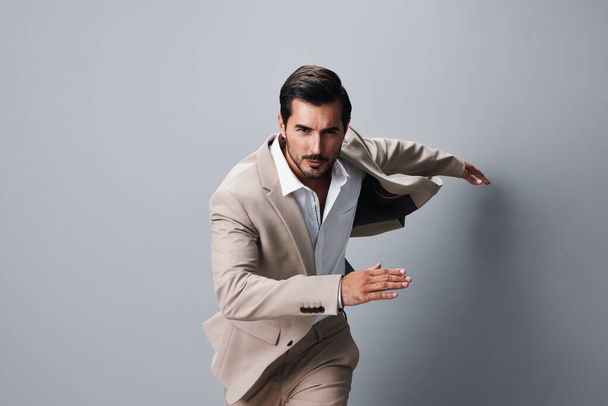 jacket man studio business occupation flying beige happy smile suit arm businessman shirt victory attractive hand winner running office sexy jumping male - Photo, Image