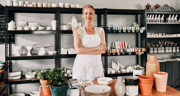 Happy woman, portrait and pottery with arms crossed in small business confidence for crafting in retail store. Confident female person, ceramic designer or owner smiling for craft or creative startup. - Fotó, kép