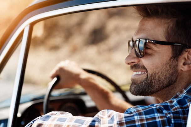 Road trip, happy and man travel in car driving for adventure, summer vacation and holiday. Transportation, relax and face of male person in motor vehicle for freedom, journey and happiness in window. - Photo, Image