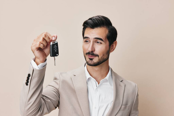 background man holding person car key new business system service buy auto keyboard electronic hand locking loan automobile sale safety smile - Photo, Image