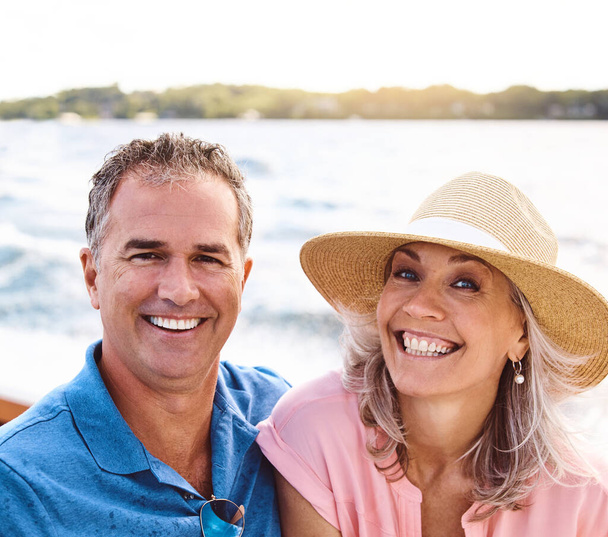 Nothing like a little vitamin sea. Portrait of a mature couple enjoying a relaxing boat ride - Photo, Image