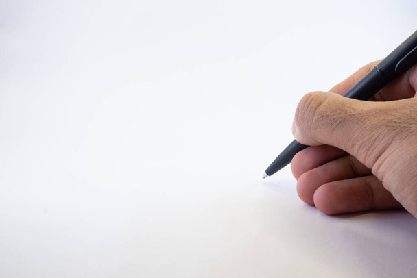 isolated hand holding a pen on white - Foto, imagen