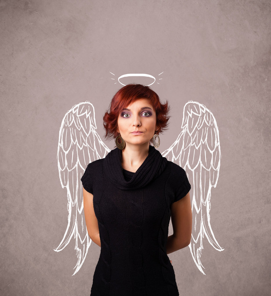 Cute girl with angel illustrated wings - 写真・画像