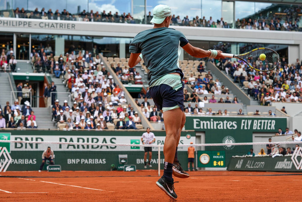 PARIS, FRANCE - MAY 30, 2022: Professional tennis player Holger Rune of Denmark in action during his round 4 match against Stefanos Tsitsipas of Greece at 2022 Roland Garros in Paris, France - Photo, Image