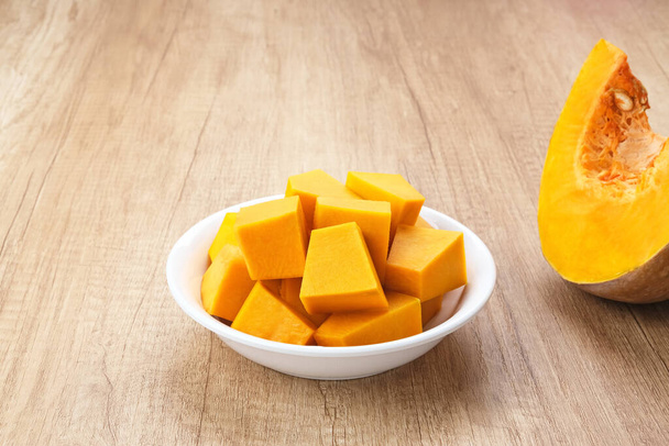 Pumpkin Slice or Labu Kuning on wooden table, food ingredient - Photo, Image