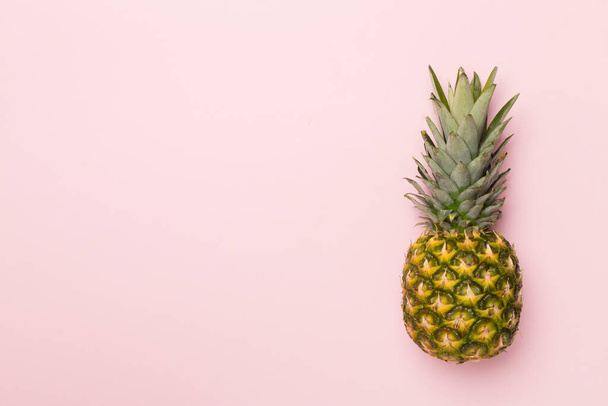 Fresh pineapple on color background, top view - Фото, изображение