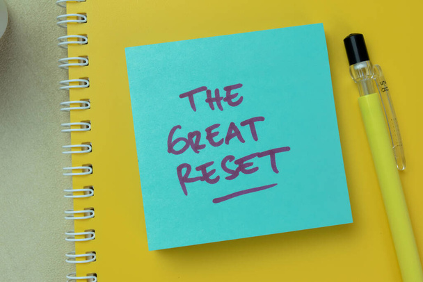 Concept of The Great Reset write on sticky notes isolated on Wooden Table. - Photo, Image