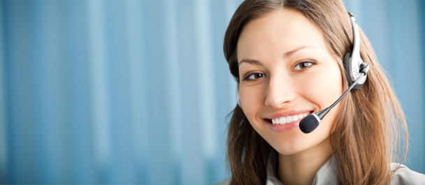 Portrait of happy smiling support phone operator in headset at w - Zdjęcie, obraz