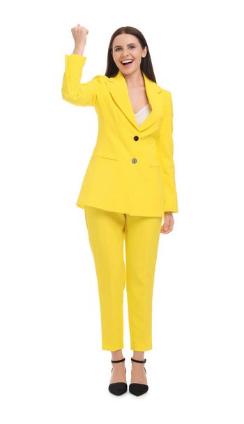 Beautiful businesswoman in yellow suit on white background - Foto, afbeelding