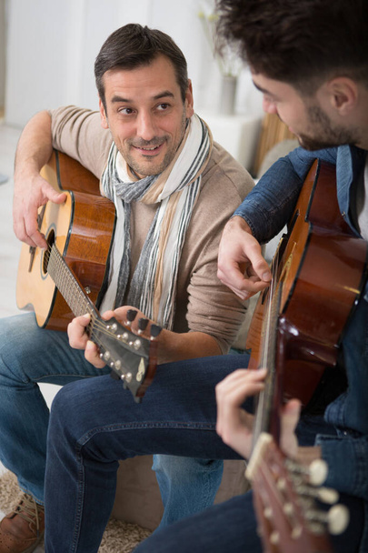 two guitar players with classic guitars - Foto, Bild