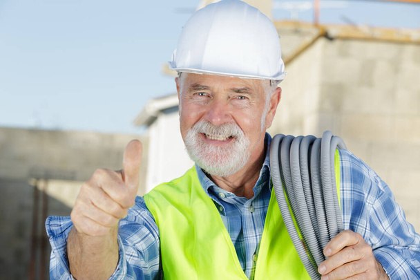 senior construction manager controlling building site - Foto, Bild