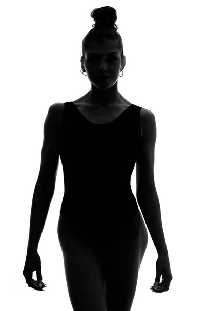 Sexy woman silhouette portrait with black underwear isolated against white background. Studio portrait. Black and white. - Фото, изображение