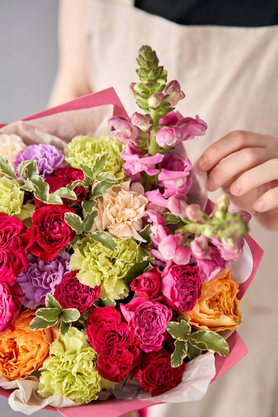 Beautiful mono bouquet of flowers in woman hand. Floral shop concept . Beautiful fresh cut bouquet. Flowers delivery. - Photo, Image