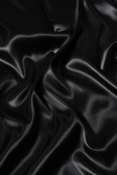 Silk fabric, abstract wavy black satin fabric background - Fotografie, Obrázek