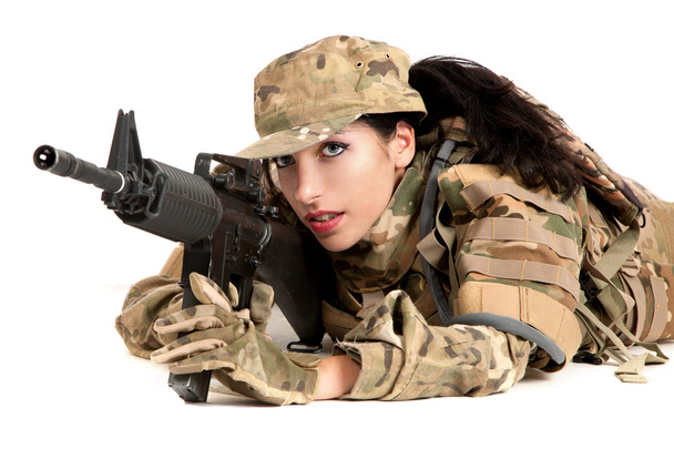 Beautiful army girl with rifle is aiming - 写真・画像