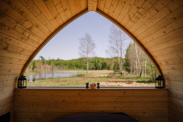 view from the window outside the igloo sauna to nature in sunny weather - Photo, Image