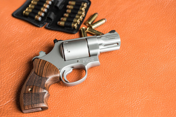 .44 magnum revolver gun with bullet on leather background personal defence - Photo, image