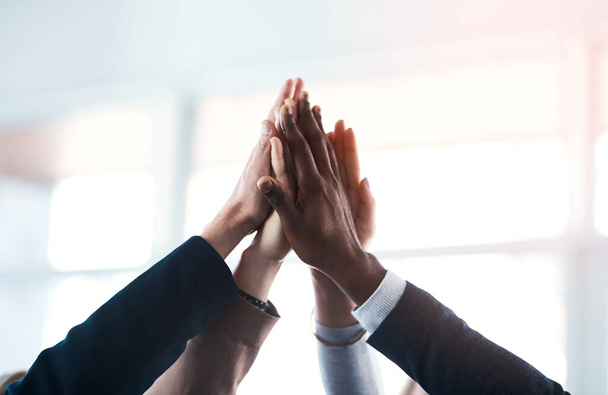 High five, colleagues and their hands together for their achievement with lens flare. Collaboration or team, group of businesspeople for support and friends with hand for cooperation or goal. - Zdjęcie, obraz