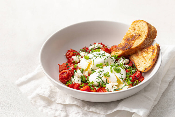 Portion of gourmet breakfast with poached eggs and tomatoes - Zdjęcie, obraz
