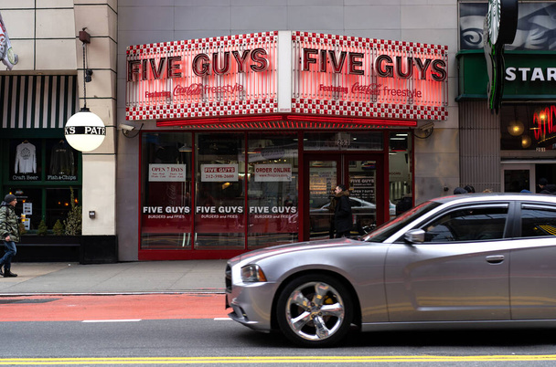 NEW YORK - FEBRUARY, 2020: Five Guys fast food burger restaurant. It is an American fast casual restaurant chain focused on hamburgers, hot dogs, and French fries. - 写真・画像