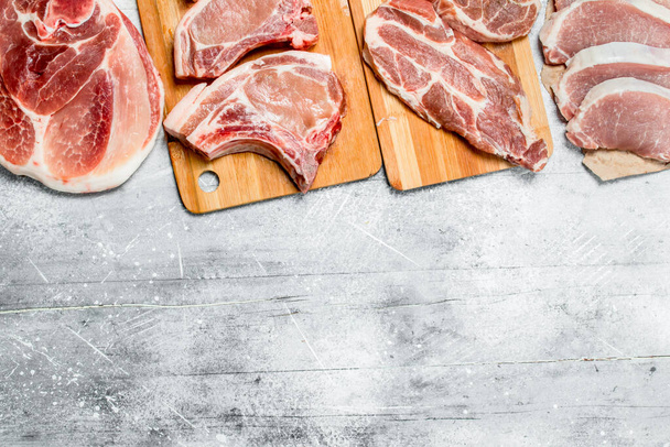 variety of raw meat pork. On a rustic background. - Photo, Image