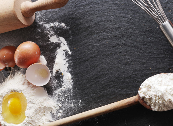Dough preparation. Baking ingredients: egg and flour.  - Φωτογραφία, εικόνα