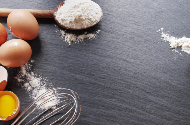 Dough preparation. Baking ingredients: egg and flour.  - Фото, зображення