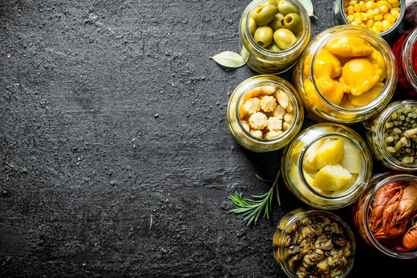 Homemade pickled food. On black rustic background - Photo, image