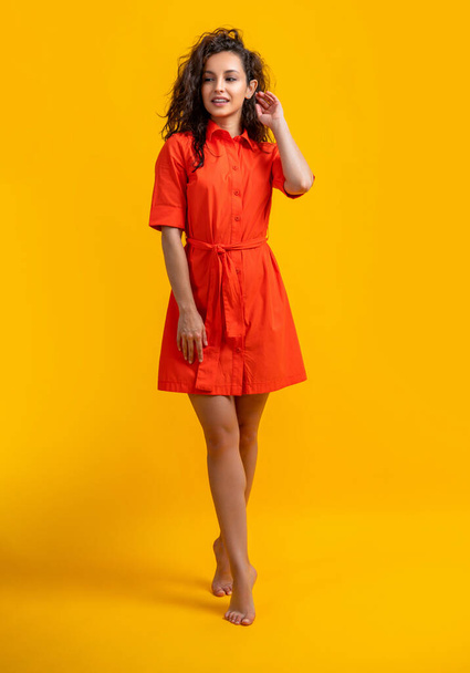 stylish caucasian girl smile isolated on yellow. stylish caucasian girl in studio. stylish caucasian girl on background. photo of stylish caucasian girl wearing bright. - 写真・画像