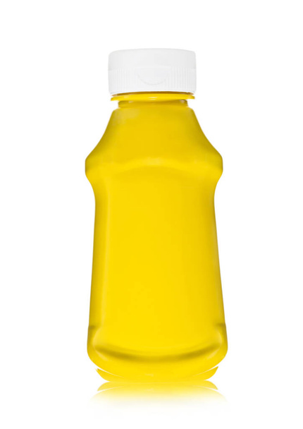 Bottle of classic yellow honey mustard sauce dip on white. - Фото, изображение