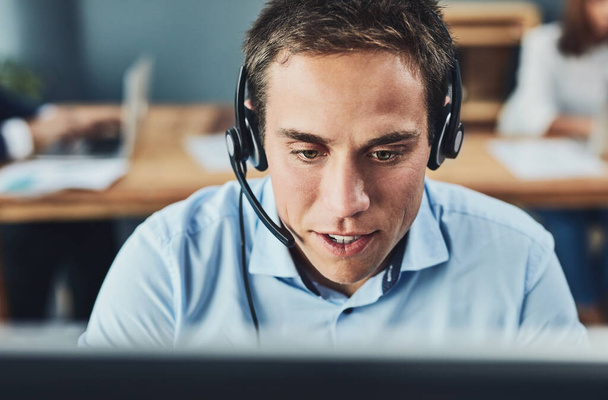 Businessman, call center and consulting with headphones on computer in customer service, support or telemarketing at office. Man consultant agent talking on PC for online advice or help in contact us. - Foto, Imagem