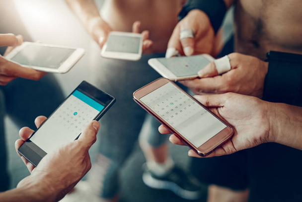 Group, hands and phone screen for fitness app, communication and internet connection. Men and women together with tech for website ux, cloud and networking or social media for exercise goals. - Foto, imagen