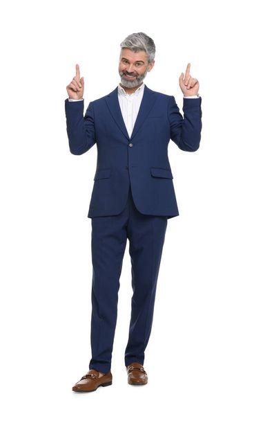 Mature businessman in stylish clothes posing on white background - Foto, Imagen