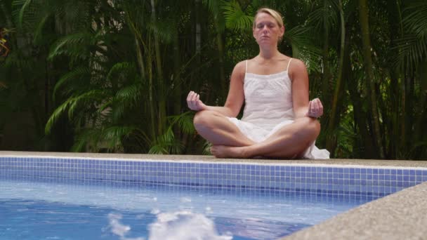 Meditating by pool - Footage, Video
