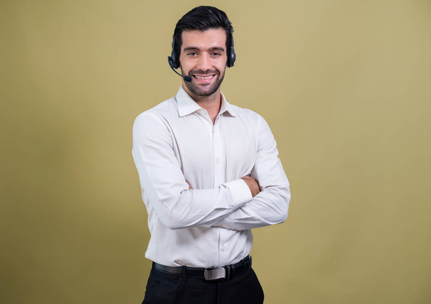 Male call center operator wearing headset and formal suit standing confidently on isolated background portrait. Professional smile and service minded for customer service and support. fervent - Φωτογραφία, εικόνα