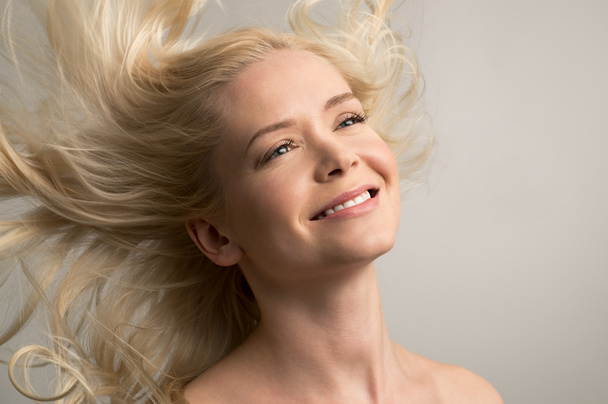 Young woman with wind in the hair - Photo, image